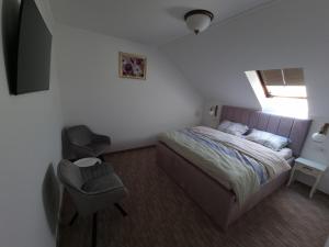 מיטה או מיטות בחדר ב-Mini Paradis