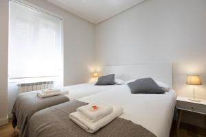 Posteľ alebo postele v izbe v ubytovaní Haizea by Smiling Rentals
