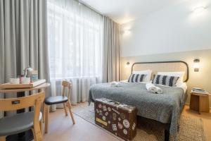 Letto o letti in una camera di Bob W Kluuvi