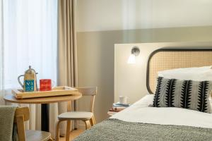 Letto o letti in una camera di Bob W Kluuvi