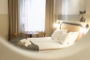 Letto o letti in una camera di Bob W Kluuvi