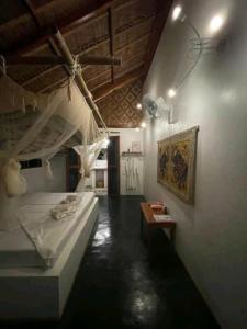 Katil atau katil-katil dalam bilik di Nypa Style Resort Camiguin