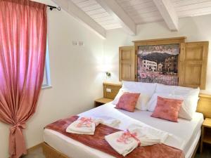 Posteľ alebo postele v izbe v ubytovaní La Finestra sul Giardino - B&B