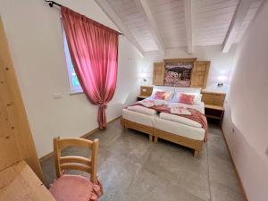 Posteľ alebo postele v izbe v ubytovaní La Finestra sul Giardino - B&B