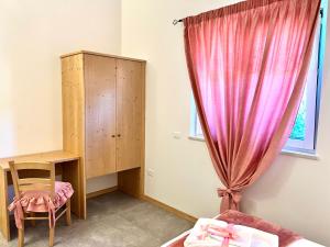 Posteľ alebo postele v izbe v ubytovaní La Finestra sul Giardino - B&B