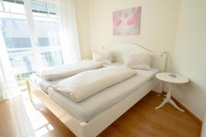 Postel nebo postele na pokoji v ubytování Villa Hubertus Enzian + 30 fotografií