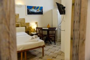 Postel nebo postele na pokoji v ubytování B&B Demetra Appartamenti