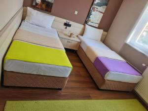 Ένα ή περισσότερα κρεβάτια σε δωμάτιο στο Hotel Bulevar