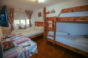 a bedroom with two bunk beds and a table at Hunter in Štúrovo +37 photos
