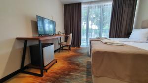 Ένα ή περισσότερα κρεβάτια σε δωμάτιο στο CAROUSEL HOTEL
