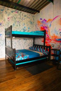 a bedroom with two bunk beds in a room at Hostal Liliana in Buenaventura