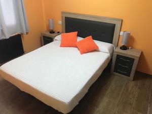 A bed or beds in a room at Agradable casa con patio a 100 metros de la playa
