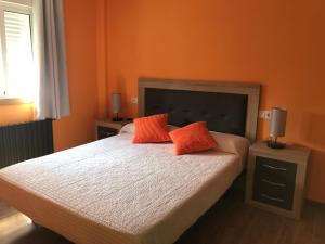 A bed or beds in a room at Agradable casa con patio a 100 metros de la playa