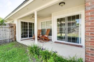 a patio with two chairs on a house at Bermuda Drive Abode in Fleming Island