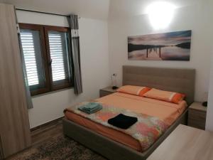 Tempat tidur dalam kamar di Villetta degli ulivi