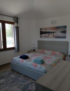 Tempat tidur dalam kamar di Villetta degli ulivi
