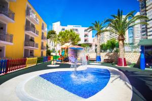 a small playground with a water slide in a city at Hotel Servigroup Pueblo Benidorm in Benidorm