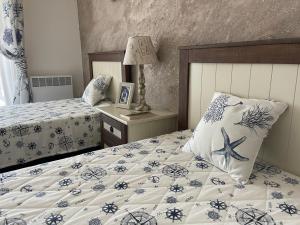 A bed or beds in a room at Sozopolis Cliffs Luxury Seaview Villa Még 37 kép