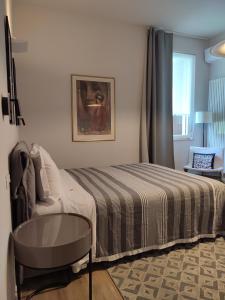 A bed or beds in a room at Nuova Porta dei Musicisti - Locazione Turistica