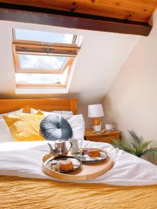 a tray of food on top of a bed at Lizzys Little Kitchen Town Accommodation in Listowel