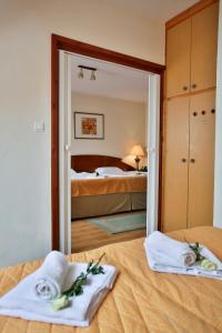 Postel nebo postele na pokoji v ubytování Hotel Rittinger