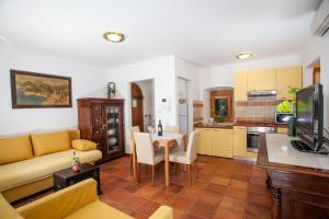 a living room with a couch and a table at Apartments Linda in Makarska