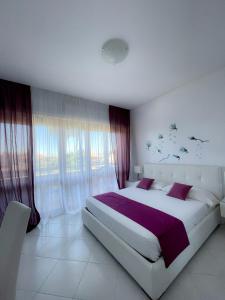 Postel nebo postele na pokoji v ubytování Resort la Magnolia