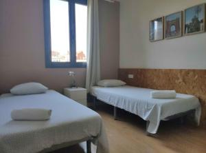 Posteľ alebo postele v izbe v ubytovaní Diagonal Apartments