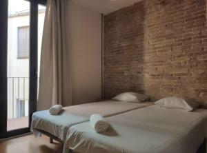 Posteľ alebo postele v izbe v ubytovaní Diagonal Apartments