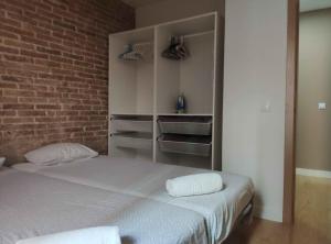 Posteľ alebo postele v izbe v ubytovaní Diagonal Apartments