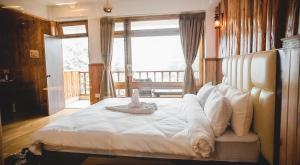 Łóżko lub łóżka w pokoju w obiekcie The Alnus Ravangla