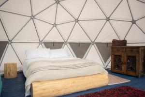 Postel nebo postele na pokoji v ubytování La Meca Glamping + 37 fotografií