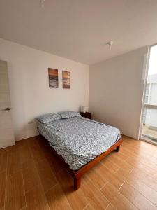 Ένα ή περισσότερα κρεβάτια σε δωμάτιο στο Punta blanca club y playa house 2