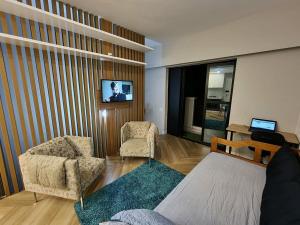 TV/trung tâm giải trí tại Conjunto Estúdio e Duplex Selenita by Alpha-StayService