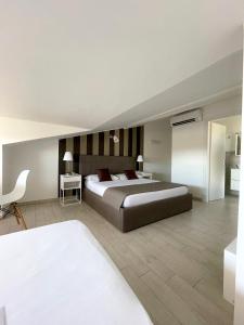 Postel nebo postele na pokoji v ubytování Resort la Magnolia