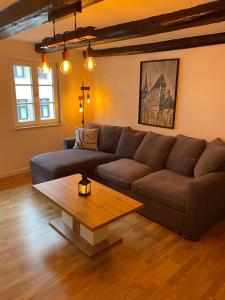 a living room with a couch and a coffee table at Harzromantik in Halberstadt