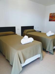 Una cama o camas en una habitación de Las Moras Rincon