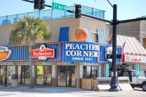 a street intersection with a traffic light in front of a building at Dry Dock 101 in Myrtle Beach
