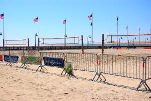 a beach with chairs and flags in the sand at Dry Dock 101 in Myrtle Beach