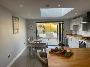 a kitchen and dining room with a table and chairs at 17 Eastgate in Cowbridge
