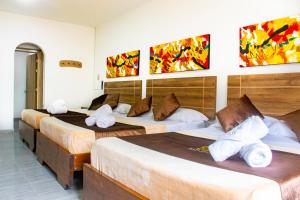 Postel nebo postele na pokoji v ubytování HOTEl PLAZA REAL