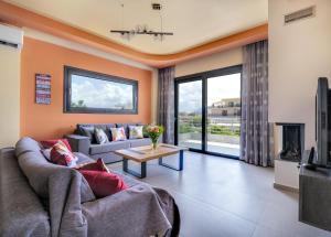 a living room with a couch and a table at Fotini 's apartment near the city center. in Chania