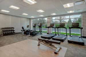 a gym with a row of treadmills and ellipticals at Fairfield by Marriott Inn & Suites Rochester Hills in Rochester Hills