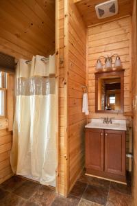 a bathroom with a shower and a sink at Cherry Hill Park in College Park