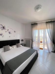 Postel nebo postele na pokoji v ubytování Resort la Magnolia