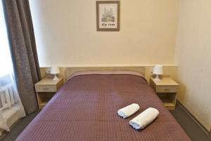Кровать или кровати в номере Отель Мэрри Поппинс