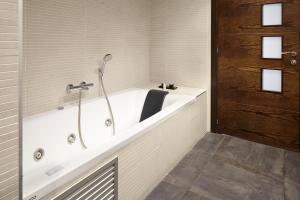 a bath tub in a bathroom with at Hotel Rural Gaintza in Getaria