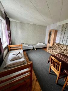 Ένα ή περισσότερα κρεβάτια σε δωμάτιο στο Jurgis Guest house