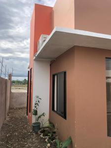a side view of a building with a window at P&Y 114 House for rent in Bayugan City