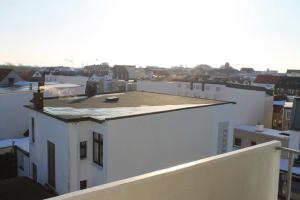 a view from the roof of a white building at Iderhoff Iderhoff 08 in Norderney +3 photos